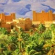 ### The Super South Morocco Holidays - Safari Tour 2025/2026 Embark on an extraordinary journey with the Super South Morocco Holidays - Safari Tour 2025/2026, a premier experience in Morocco tours. This exceptional tour itinerary from Marrakech offers a perfect blend of adventure, culture, and relaxation, making it one of the best Marrakech tour itineraries available. Designed for discerning travelers, this Morocco safari tour takes you through the heart of the country's most captivating landscapes and historical sites. Start your adventure with exhilarating Marrakech excursions, including a scenic drive through the High Atlas Mountains and visits to ancient kasbahs such as the UNESCO-listed Ait Benhaddou. As you travel deeper into the southern regions, explore the lush Draa Valley and its verdant palm groves on a unique bicycle tour. The journey continues to the stunning Sahara Desert, where you'll experience a memorable Marrakech desert tour. Ride camels across the majestic Erg Chebbi dunes in Merzouga, enjoy traditional Berber hospitality, and spend nights under the star-studded desert sky. Discover the vibrant culture of the Merzouga region, with opportunities for camel treks, ATV rides, sandboarding, and more. The Morocco desert tour also includes a visit to the dramatic Todra Gorge and the picturesque Dades Valley, where you can trek through scenic trails and enjoy a traditional Berber lunch. The adventure culminates with a drive through the beautiful Rose Valley and a visit to the film-making hub of Ouarzazate before returning to the vibrant city of Marrakech. The Super South Morocco Holidays - Safari Tour 2025/2026 offers an unparalleled experience, combining the best elements of Moroccan culture, history, and natural beauty. Whether you're seeking thrilling adventures, cultural immersion, or serene landscapes, this tour promises an unforgettable journey through the super south of Morocco.