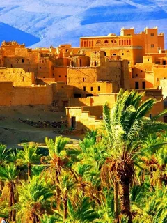 The **Luxury Desert Tour from Marrakech to Fes (4 Days)** offers an immersive and refined experience through some of Morocco's most stunning landscapes. Starting in vibrant Marrakech, the journey takes you through the towering Atlas Mountains, with a stop at the UNESCO World Heritage site of **Ait Benhaddou**. Travelers continue to the scenic **Dades Valley** for an overnight stay in a luxurious desert riad. Day two brings a deeper exploration of the desert, leading to the dramatic **Todra Gorge** and the majestic dunes of **Merzouga**, where you can enjoy a camel ride and a night under the stars in a luxury desert camp. The following day is spent discovering the rich culture and nomadic traditions of Merzouga, with options for activities like sandboarding or visiting a Berber village. The final leg of the tour heads towards Fes, passing through the enchanting **Ziz Valley** and **Midelt**, offering a glimpse of the diverse landscapes that define Morocco’s heartland. This tour blends adventure and comfort, providing an unforgettable desert experience with all the amenities of luxury travel.